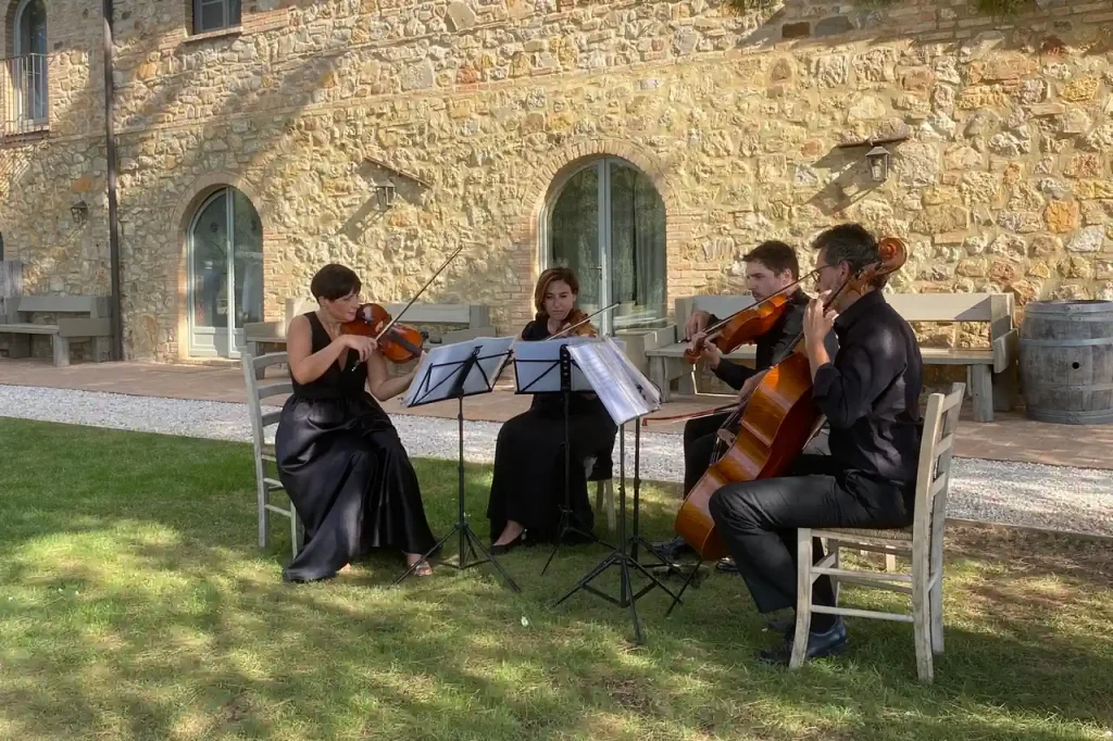 Wedding Ceremony: A group of people playing instruments outside